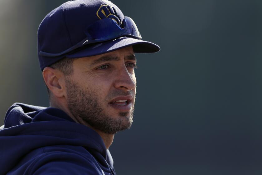 Milwaukee Brewers' Ryan Braun looks on during spring training baseball Wednesday, Feb. 19, 2020, in Phoenix. (AP Photo/Gregory Bull)