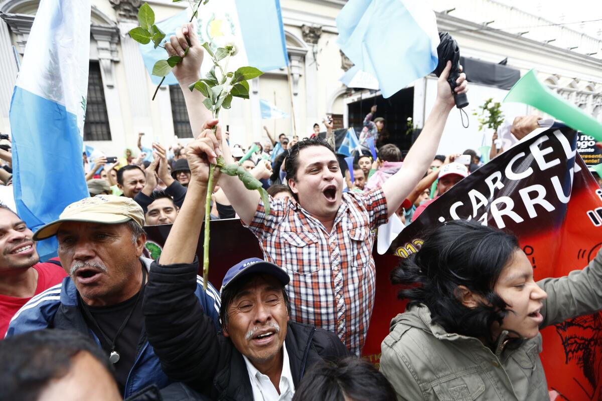 Demonstrators celebrate outside the Congress building in Guatemala City on hearing that President Otto Perez Molina's immunity had been stripped.