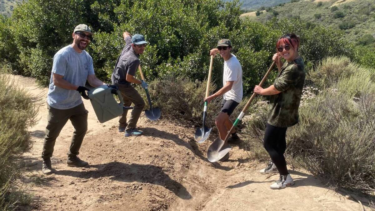 Volunteers perform trail work along Laguna Canyon.