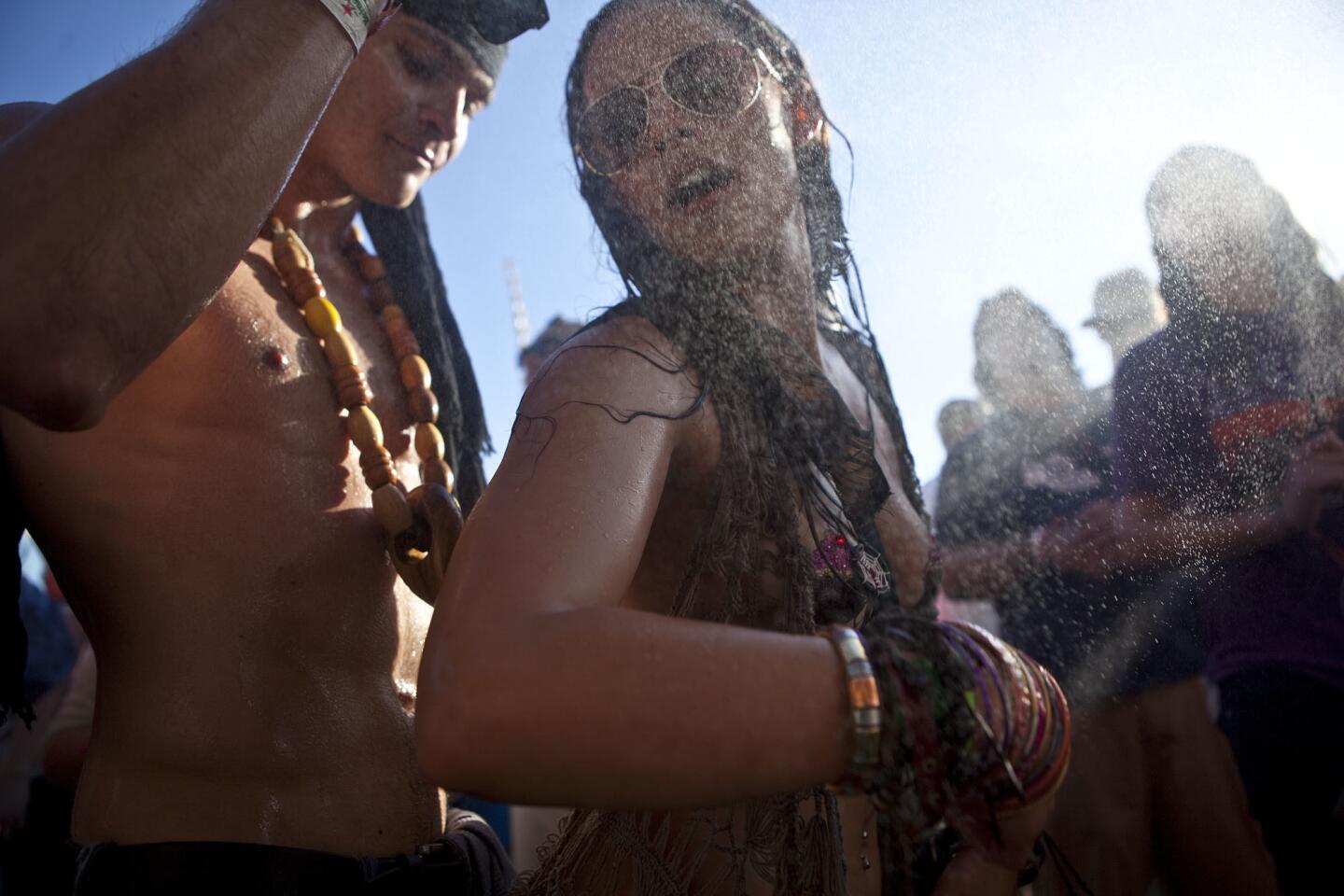 Jessica Mitchell dances to the beat of David Starfire in the Do Lab on the third day of the Coachella Music Festival, 2012.
