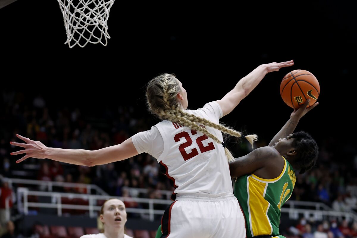 Stanford forward Cameron Brink (22) blocks a shot as Oregon forward Taylor Hosendove (11) goes toward the basket during the first half of an NCAA college basketball game Sunday, Jan. 29, 2023, in Stanford, Calif. (AP Photo/Josie Lepe)