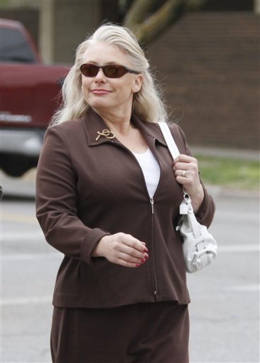 FILE - In this April 20, 2011 file photo, Angel Dillard of Valley Center, Kan. arrives at the U.S. Federal District Courthouse in Wichita, Kan. A civil court lawsuit was filed in April 2011 against the abortion opponent who allegedly sent a threatening letter to a doctor. The government sued Angel Dillard when she wrote that thousands of people across the nation where watching the doctor and suggested she check under her car daily for explosives. Citing First Amendment protections, Judge J. Thomas Marten ruled that Dillard’s letter was not a “true threat” because she did not personally intend to harm the doctor. He refused to issue a preliminary injunction that would have kept her 250 feet away from the doctor, her clinic and her home. The lawsuit is still pending while the judge awaits arguments on whether to dismiss the case entirely. (AP Photo/Jeff Tuttle, File)