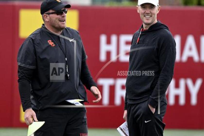 head coach Lincoln Riley, right, along with linebackers coach Matt Entz watch during spring NCAA college football practice at Howard Jones Field, Thursday, April 4, 2024, in Los Angeles. (Keith Birmingham/The Orange County Register via AP)