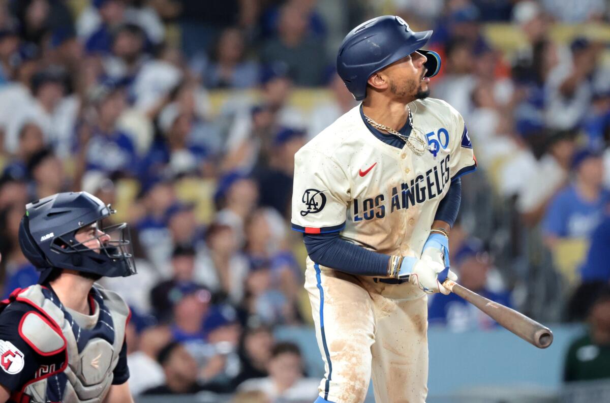 Mookie Betts hits a solo home run for the Dodgers during the fourth inning of a win over the Cleveland Guardians.