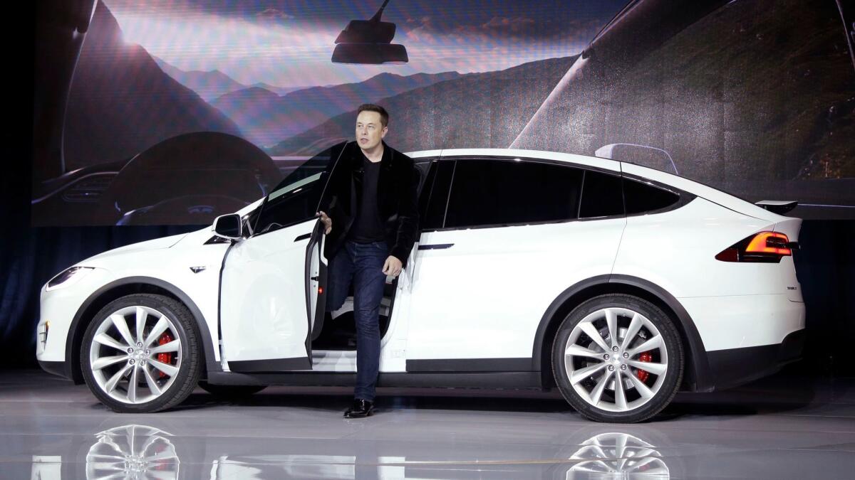 Tesla Motors CEO Elon Musk introduces the Model X at Tesla’s headquarters in Fremont, Calif. in 2015.