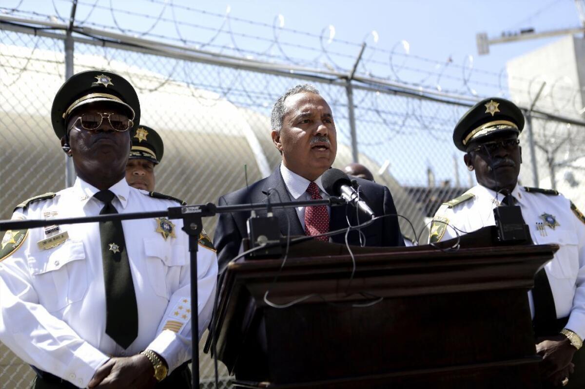 Orleans Parish Sheriff Marlin Gusman, center, is the target of criticism for poor conditions at the parish prison.