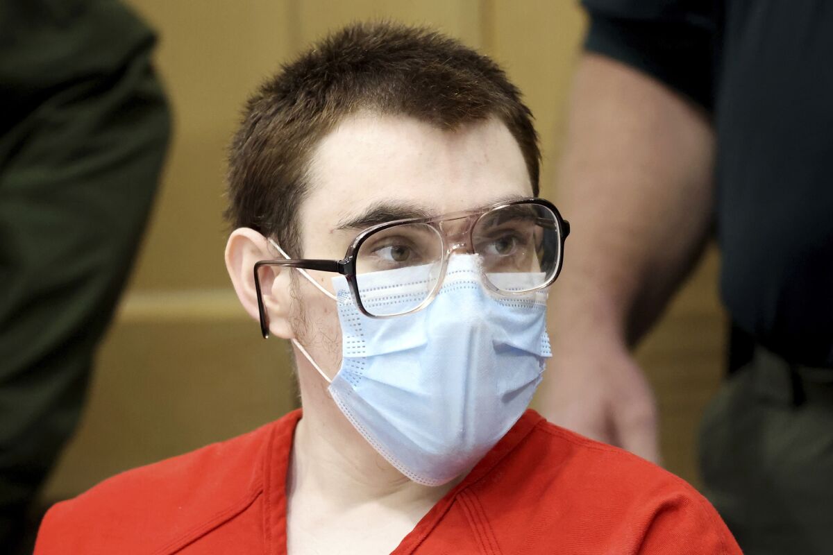 Marjory Stoneman Douglas High School shooter Nikolas Cruz is shown at the defense table during a hearing at the Broward County Courthouse in Fort Lauderdale, Fla. on Tuesday, Feb. 2, 2022. Cruz previously plead guilty to all 17 counts of premeditated murder and 17 counts of attempted murder in the 2018 shootings. (Amy Beth Bennett/South Florida Sun Sentinel via AP, Pool)