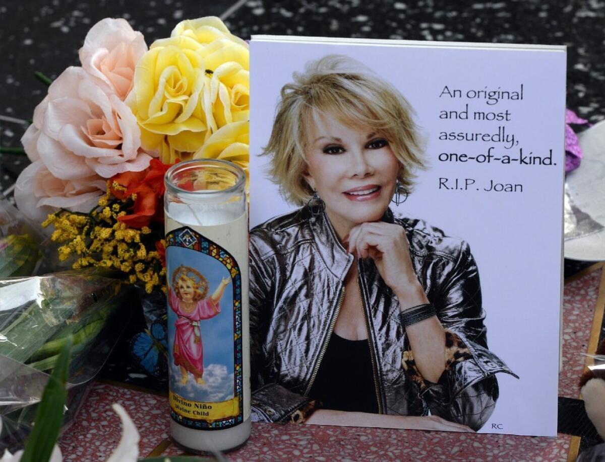 Flowers are placed on the Hollywood Walk of Fame star for Joan Rivers.