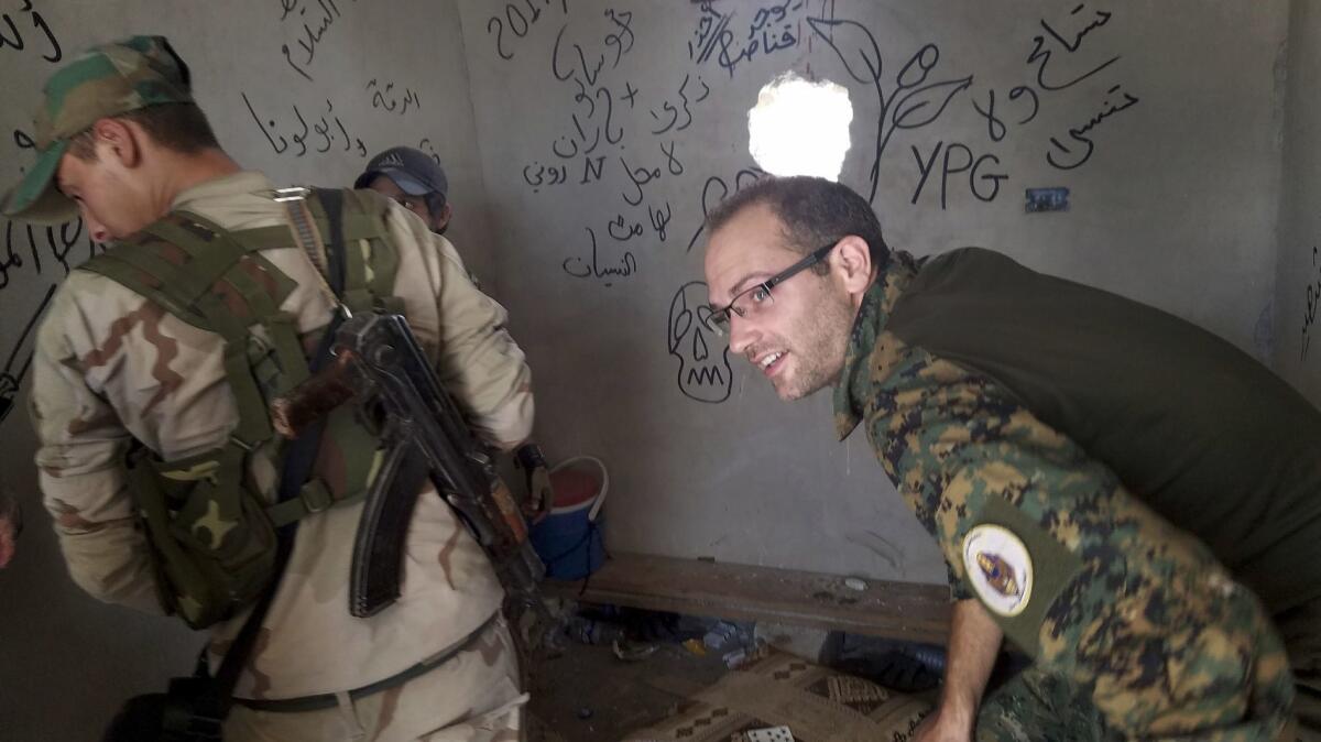 "The ones who are loved and trusted are the ones on the front line," volunteer Macer Gifford, right, said of fellow foreign volunteers fighting islamic State with Syrian opposition forces in Raqqah.