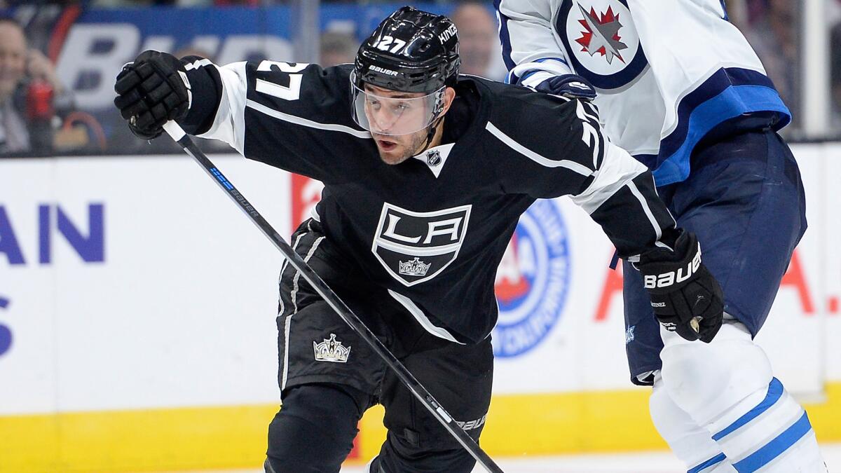 Kings defenseman Alec Martinez battles Winnipeg Jets forward Chris Thorburn during a game earlier this season.