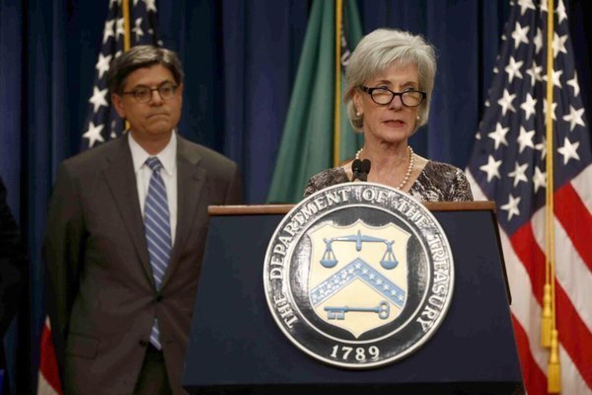 Treasury Secretary Jacob Lew listens at left as Health and Human Services Secretary Kathleen Sebelius speaks about Social Security and Medicare, at the Treasury Department in Washington.