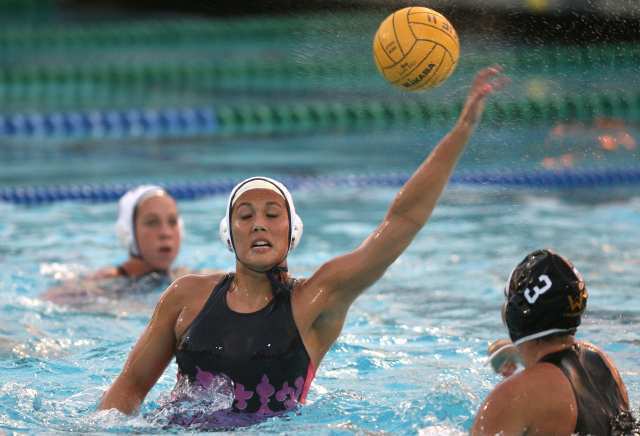 Corona del Mar's Pippa Saunders, center, blocks the shot of Foothill's Jessie Porter (3) during Wednesday's CIF Division I semifinal game at William Woollett Jr. Aquatics Center in Irvine.