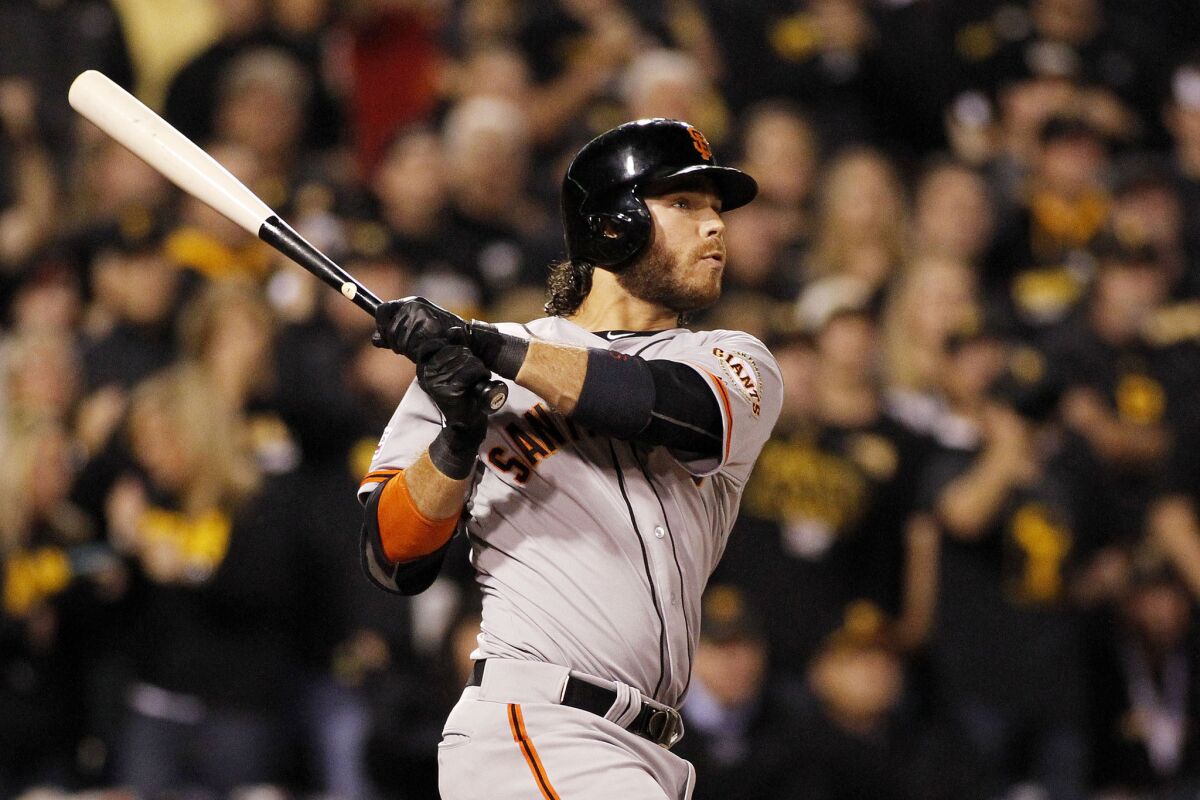 Giants shortstop Brandon Crawford hits a grand slam in the fourth inning of the National League wild-card game at PNC Park.
