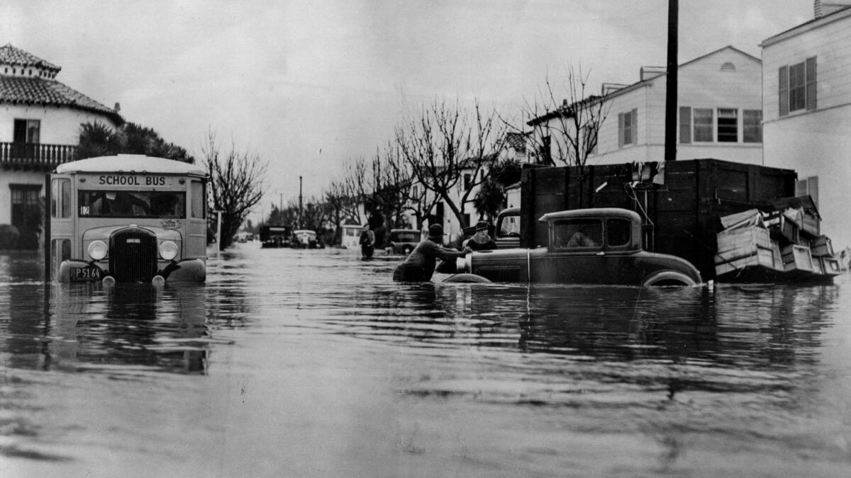 March 2, 1938: Vehicles swamped by flooding at West 43rd Place near Leimert Boulevard.