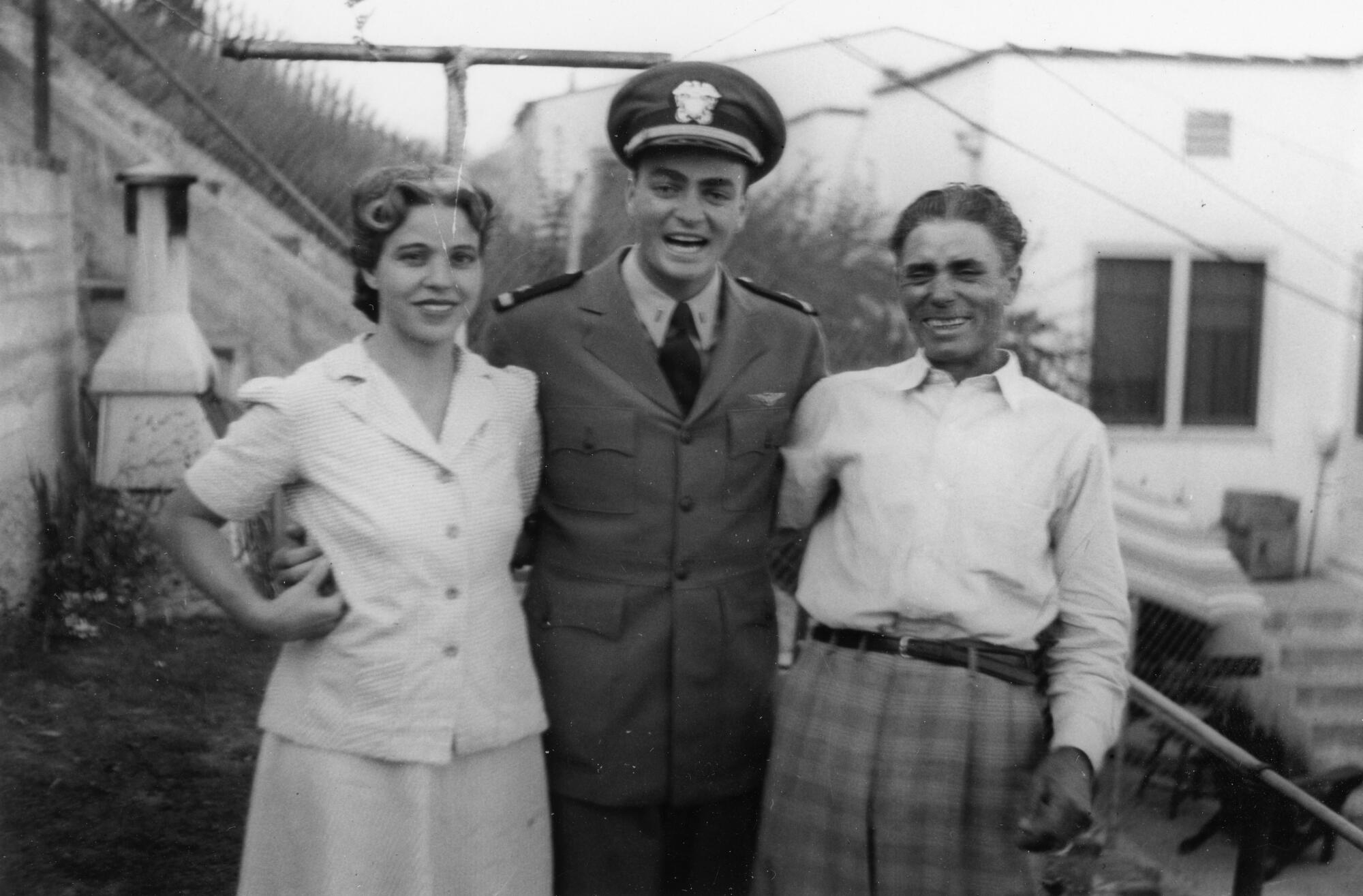 Josephine Caruso stands with her her son, Hank, and husband Augustine in the early 1940s