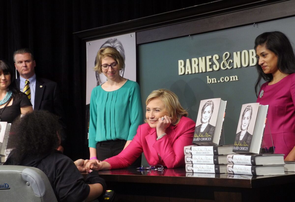Hillary Rodham Clinton greets patrons at a Barnes & Noble in New York for the signing of her new book, "Hard Choices."
