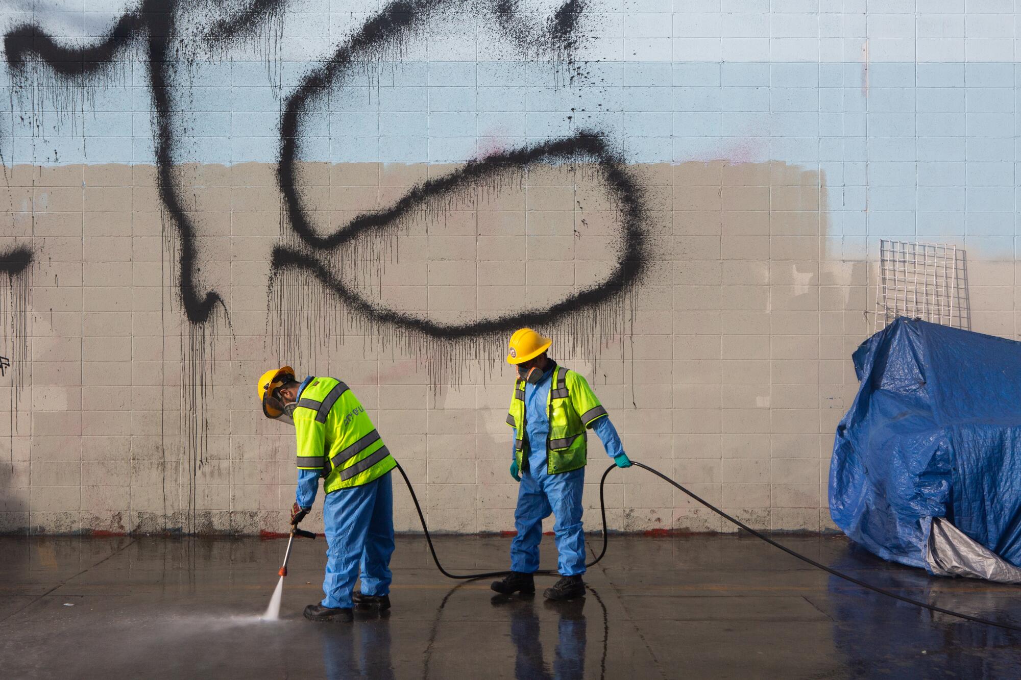 Crews clean an area along 7th Street in downtown Los Angeles.