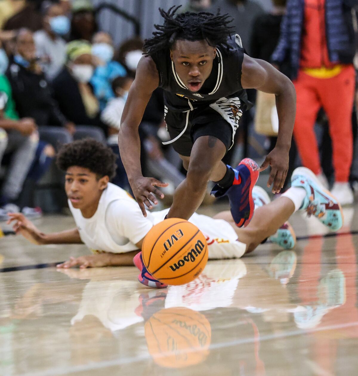 King/Drew guard Kalib Lacount steals the ball from Fairfax guard Hudson Mayes.