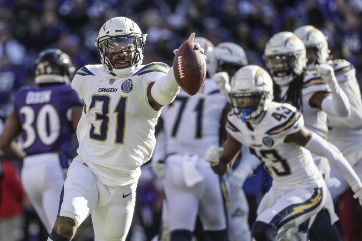 Chargers safety Adrian Phillips celebrates after intercepting a pass from Ravens quarterback Lamar Jackson in a wild-card playoff game Jan. 6.