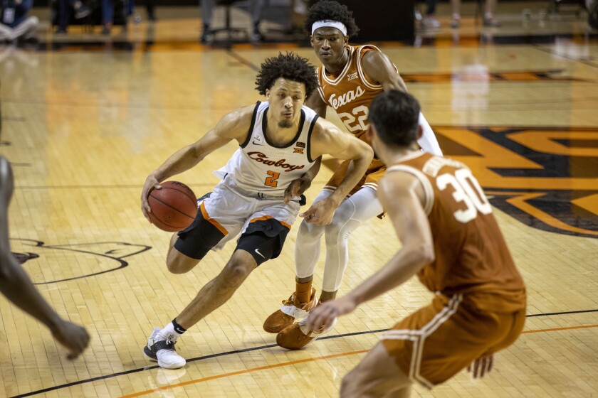 Oklahoma State's Cade Cunningham drives against Texas on Saturday.