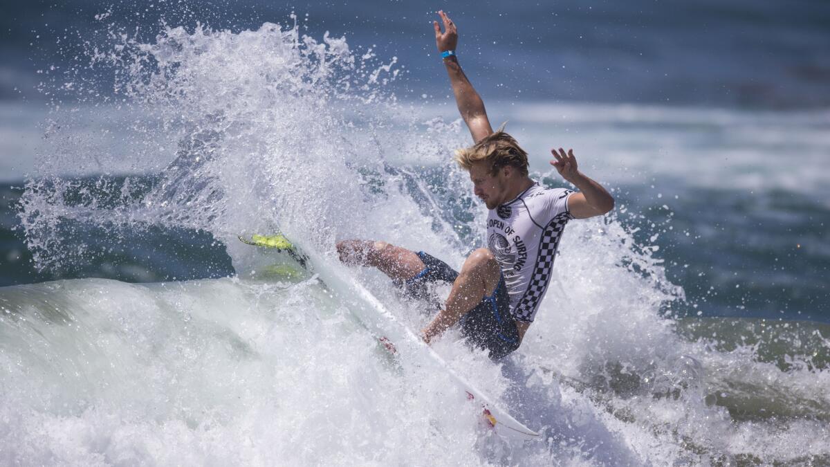 Kolohe Andino competes in last year's U.S. Open of Surfing off the Huntington Beach pier.