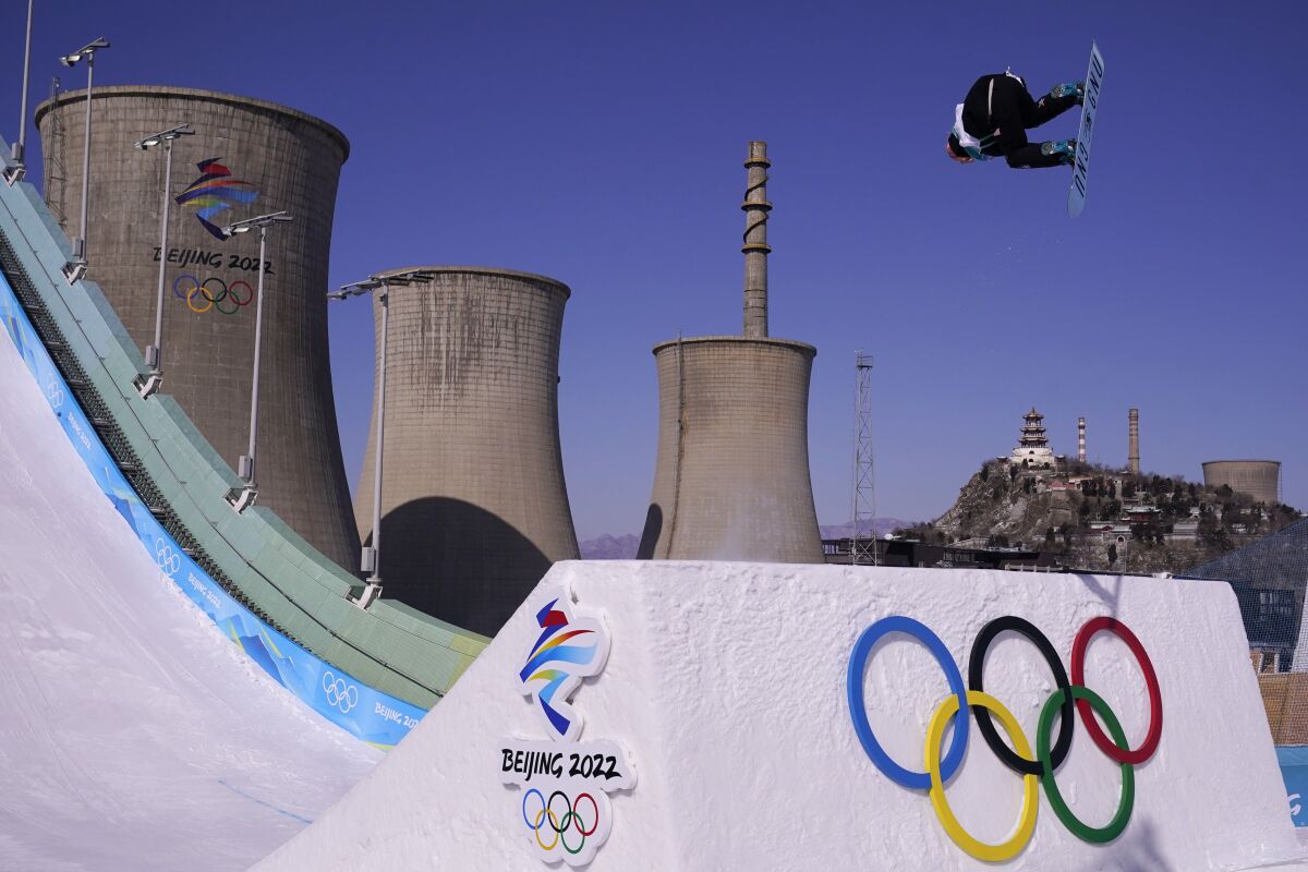 Jamie Anderson of the United States competes during the women's snowboard big air qualifications of the 2022 Winter Olympics, Monday, Feb. 14, 2022, in Beijing. (AP Photo/Ashley Landis)