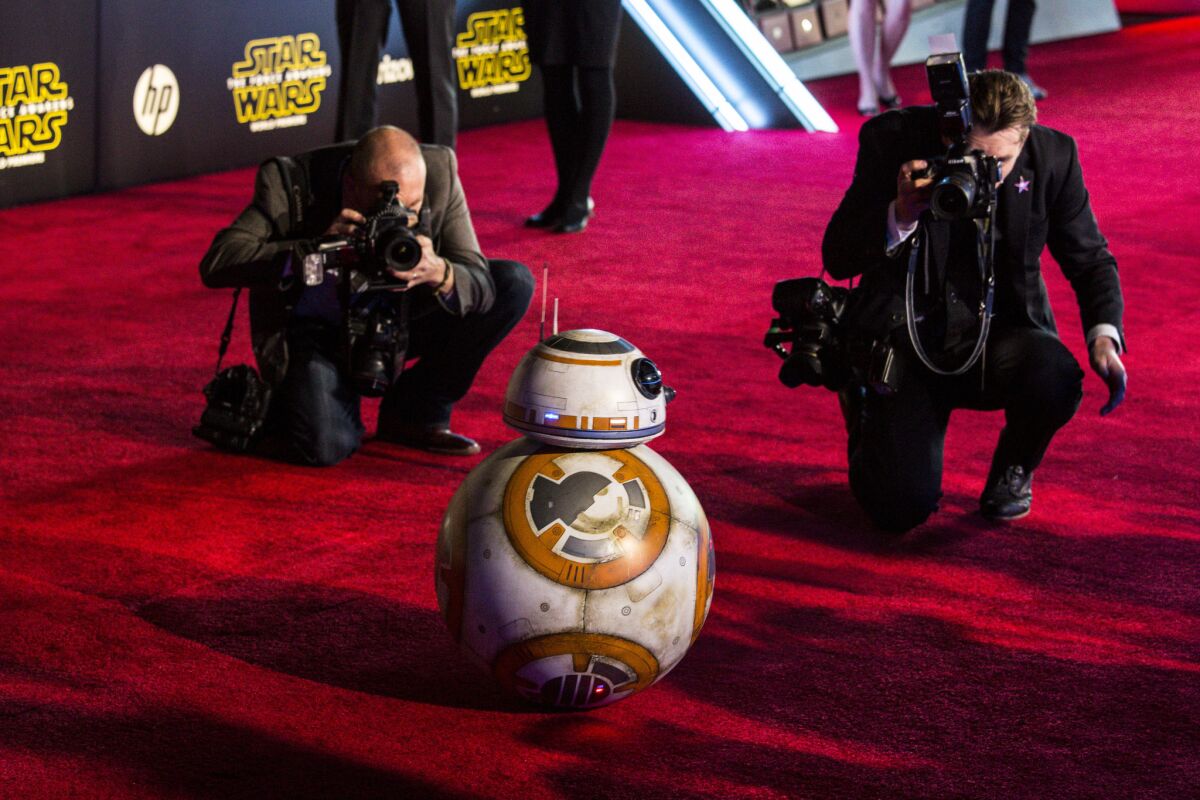 Photographers swarm droid BB-8 at the red-carpet premiere of "Star Wars: The Force Awakens" in Hollywood.