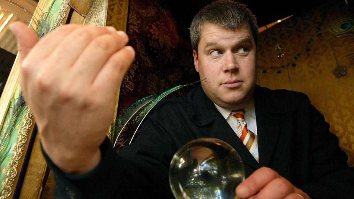 Daniel Handler in a card reader booth at Cafe Flore in San Francisco; his new novel is "All the Dirty Parts."