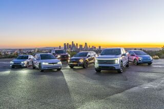 This undated photo provided by Edmunds shows their top rated car, SUV, truck and an electric version for each category. (Rex Tokeshi-Torres/Edmunds via AP)