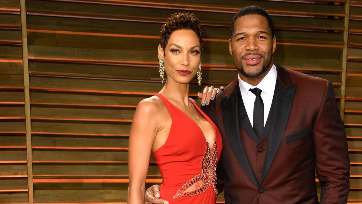 "Live!" host Michael Strahan and Nicole Murphy, shown here at the Vanity Fair Oscar party in March, have called off their engagement.