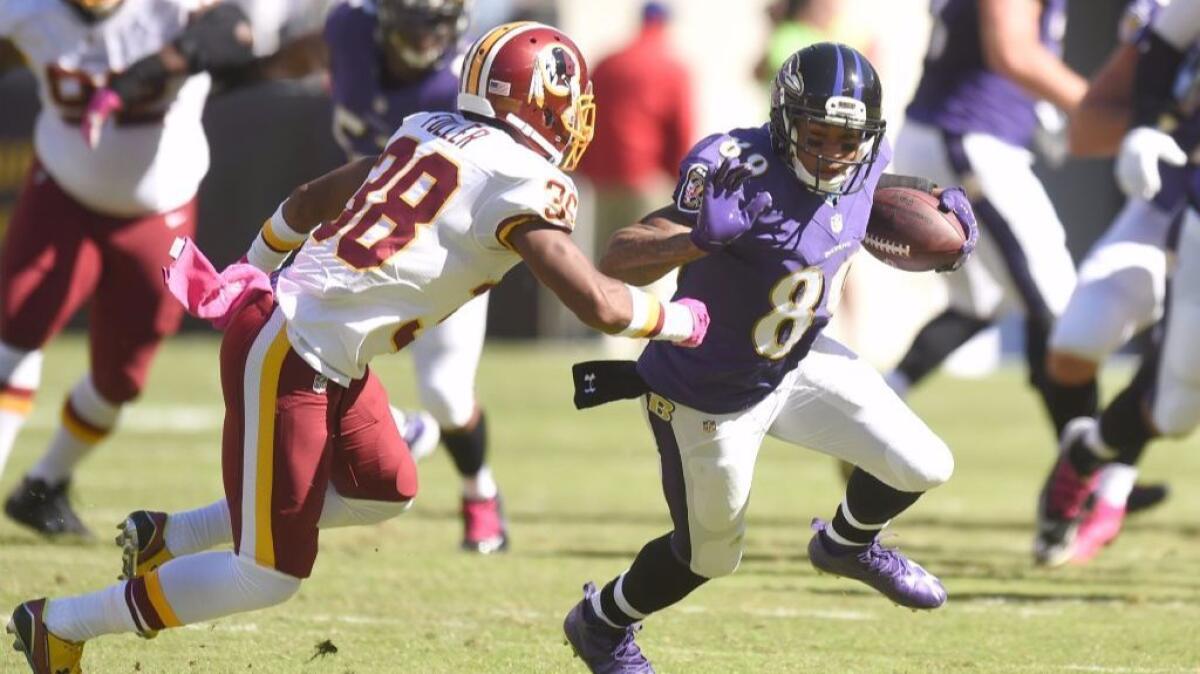 Ravens receiver Steve Smith Sr. tries to get around Redskins cornerback Kendall Fuller during the first quarter of a game on Oct. 9.