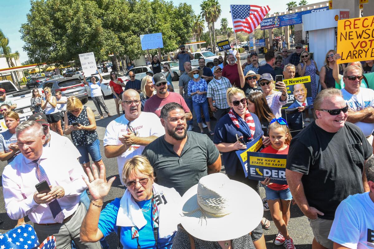 Supporters of Republican Larry Elder cheer for him at a rally in downtown Los Angeles on Sept. 7. 