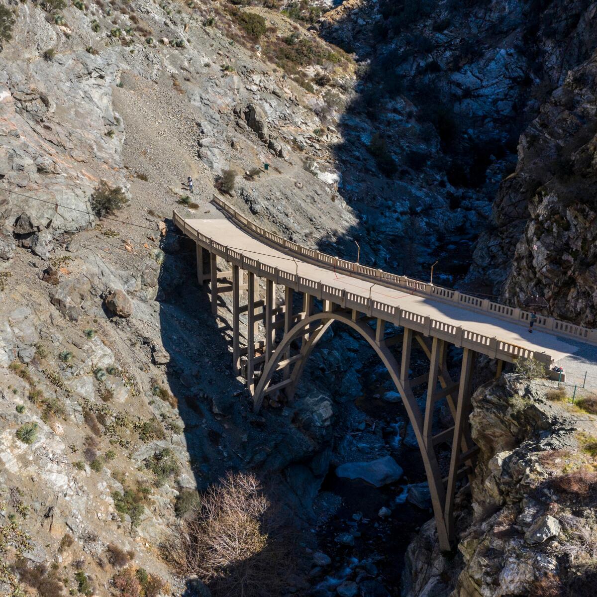 A bridge spans a steep canyon.
