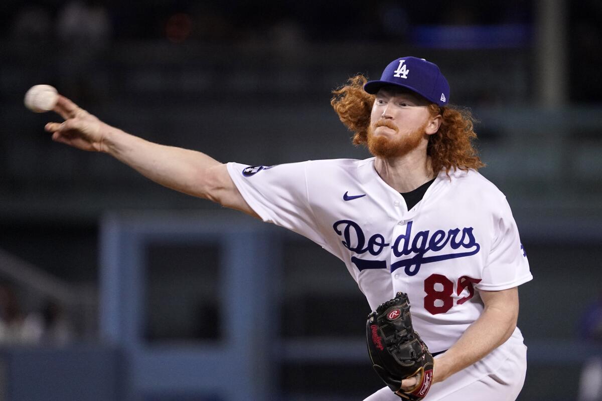 Dodgers starting pitcher Dustin May throws to the plate against the Diamondbacks in September.