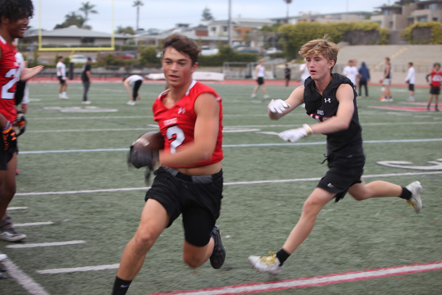 Tommy Castronovo carries the ball during the La Jolla High School football team's spring game June 3.