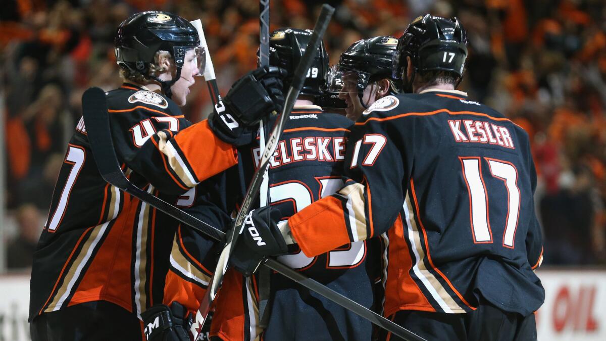 The Ducks celebrate a first-period goal by defenseman Hampus Lindholm during Game 1 of the Western Conference finals against the Chicago Blackhawks at Honda Center on Sunday.