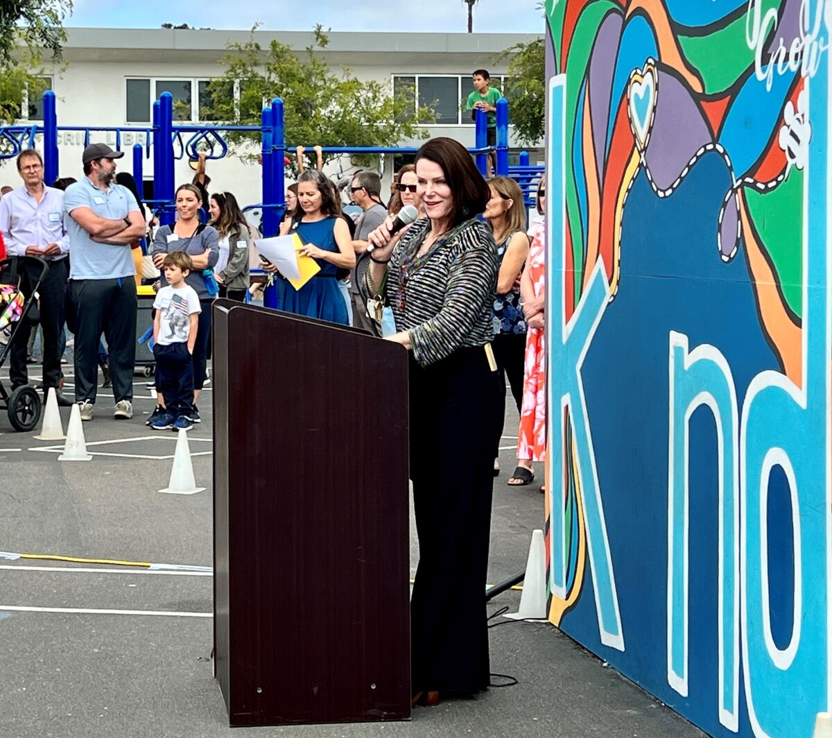 Andi Frost, who is stepping down as principal of Bird Rock Elementary School, speaks at the school's 70th-anniversary party.
