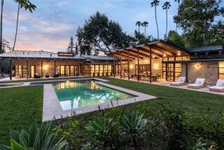 Built by architect Peter Tolkin, the three-acre estate centers on a series of wood-and-glass pavilions that wrap around a central courtyard.