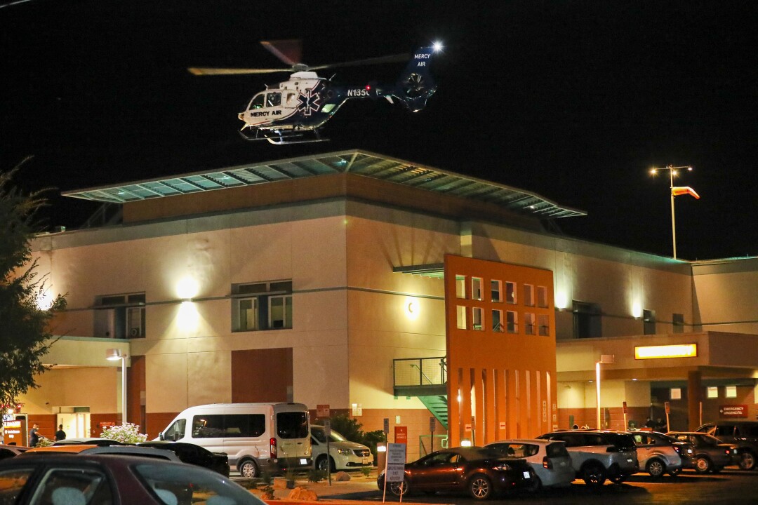An ambulance helicopter lands at El Centro Regional Medical Center to pick up a patient.