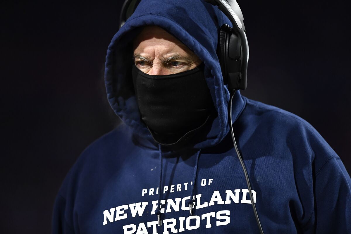 Patriots coach Bill Belichick works the sideline during the first half Jan. 15, 2022, in Orchard Park, N.Y. 