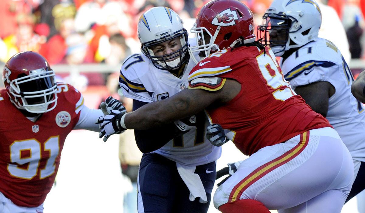 Chiefs nose tackle Dontari Poe (92) sacks Chargers quarterback Philip Rivers (17) in the second half Sunday.