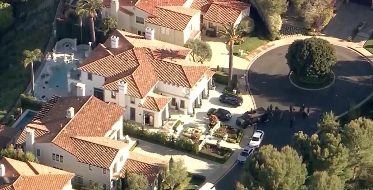 The Newport Coast home where an intruder was shot by a resident and a second suspect was found dead nearby on April 16.