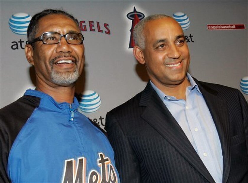 New York Mets interim manager Jerry Manuel, left, and general manager Omar Minaya talk during a news conference before the Mets' baseball game against the Los Angeles Angels, in Anaheim, Calif, Tuesday, June 17, 2008. Manuel was promoted from bench coach after manager Willie Randolph was fired. (AP Photo/Nick Ut)