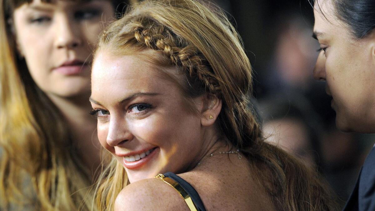 Actress Lindsay Lohan has had young people "shadow" her as a form of community service.