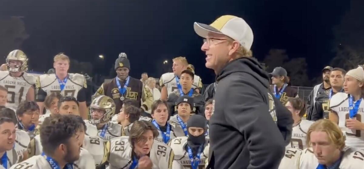 Laguna Hills High football coach John Lester talks to his team.