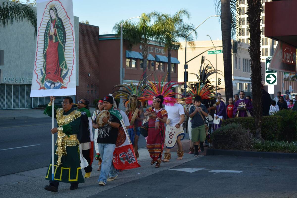 David Vazquez leads the Stations of the Cross procession throug Santa Ana in 2014.