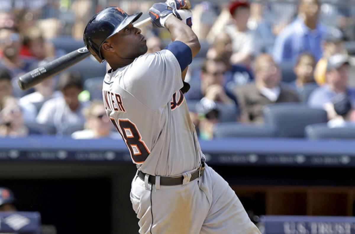 Tigers outfielder Torii Hunter follows through on a three-run home run in the sixth inning of a game against the Yankees on Saturday in New York.