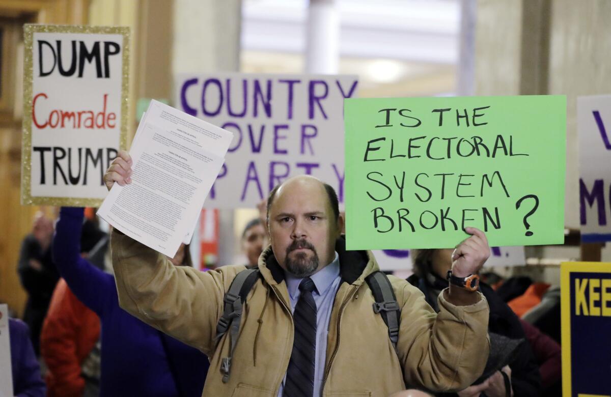 Brock Ervin demonstrates outside the Indiana House chamber.