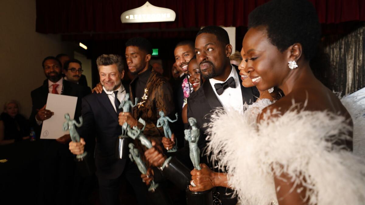 "Black Panther" cast members Andy Serkis, Chadwick Boseman, Michael B. Jordan, Lupita Nyong'o, Sterling K. Brown, Angela Bassett, and Danai Gurira celebrate backstage at the 25th Screen Actors Guild Awards.