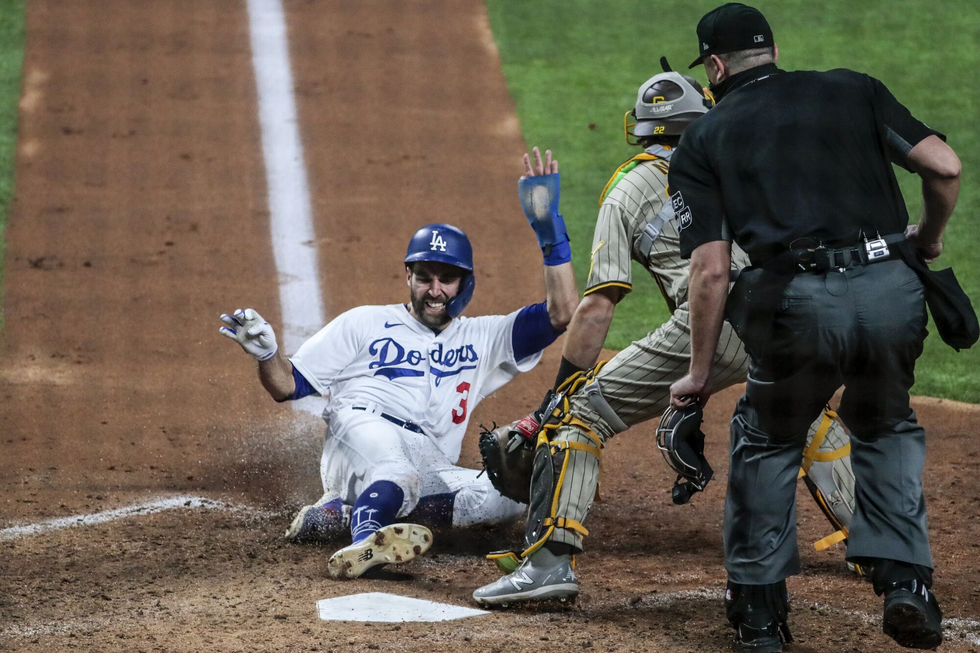 Dodgers second baseman Chris Taylor scores during the sixth inning against the Padres in Game 1.